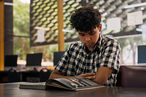 Student studying in a modern library